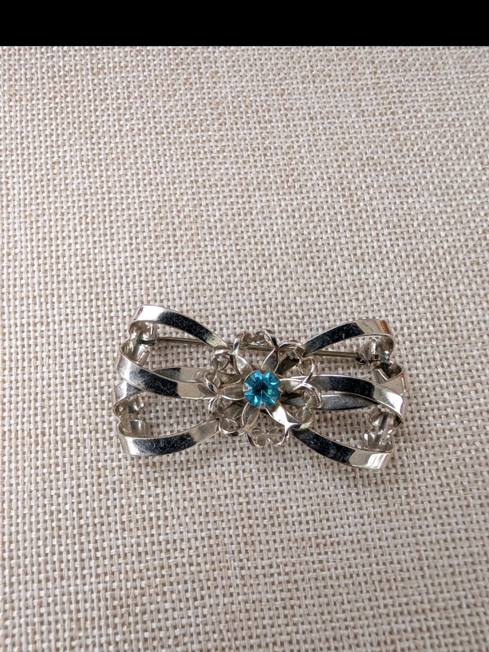 Silver-Tone Floral Bow Brooch with Blue Crystal Center